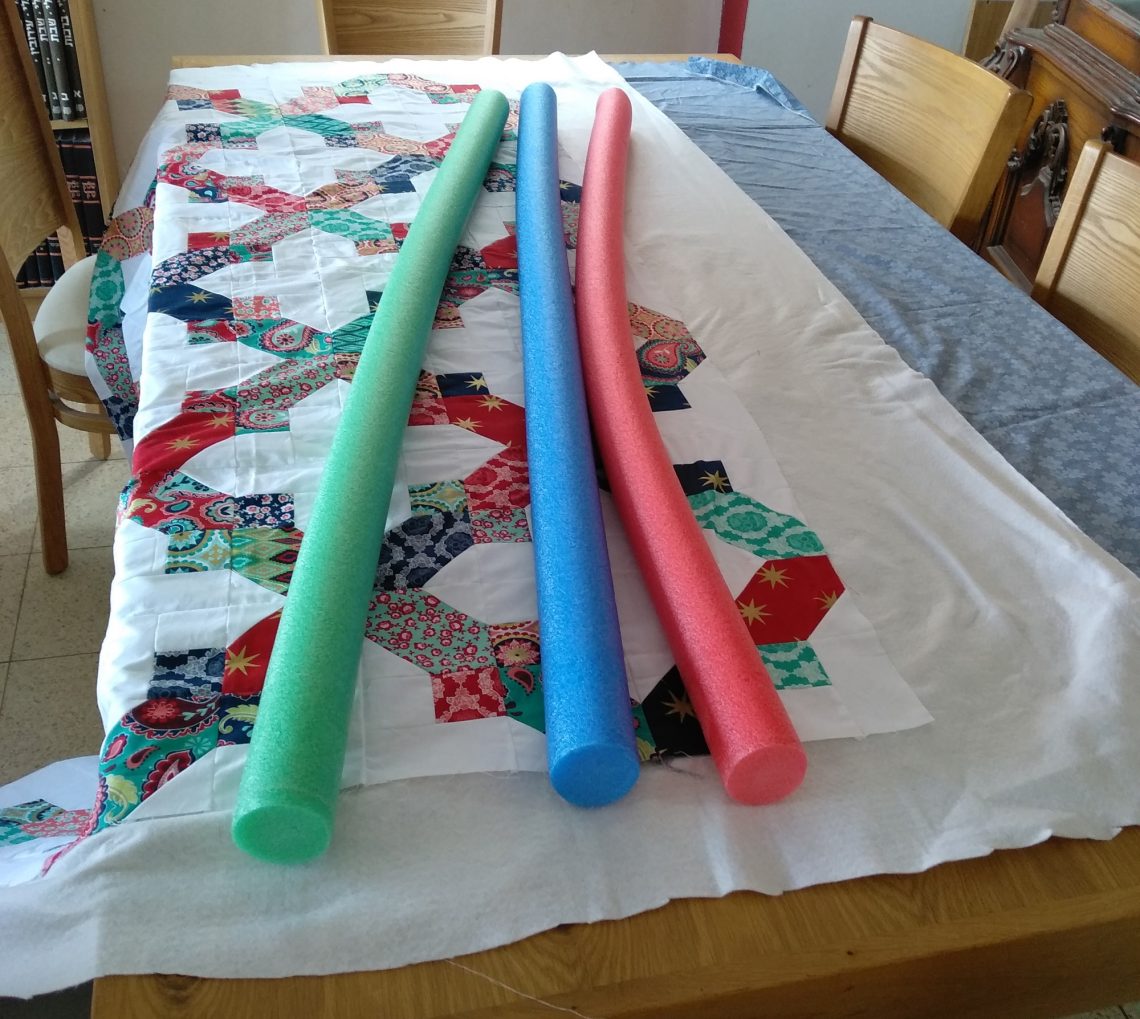 Basting a Quilt With Pool Noodles